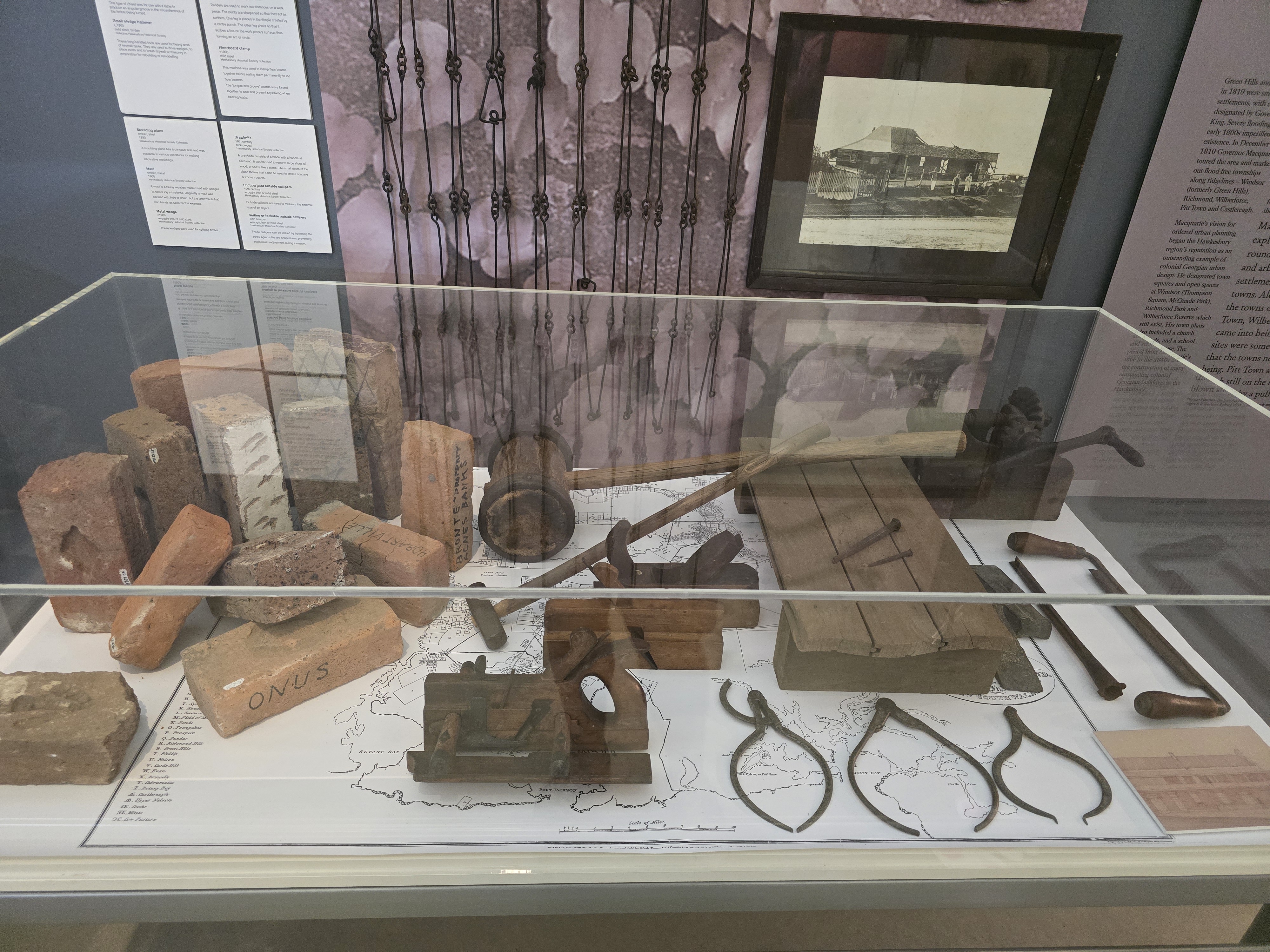 Interpretive labels describing tools used in everyday and skilled work